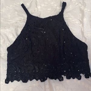 Black “cropped” top with sequencing